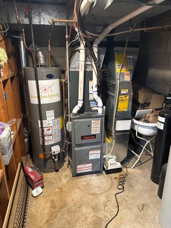 Completed warranty service on Amana furnace, replacing faulty gas valve and pressure switch per coverage sold by Xavier. Temperature readings were verified with digital thermometer to confirm proper system operation after installation of new components.