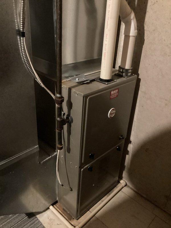Performed comprehensive furnace tune-up on Ruud residential unit. Inspected and tested all components including circuit board, which showed some corrosion but remains functional. System operation verified normal with no current issues identified. Documented condition with photos of furnace installation and control board for reference.