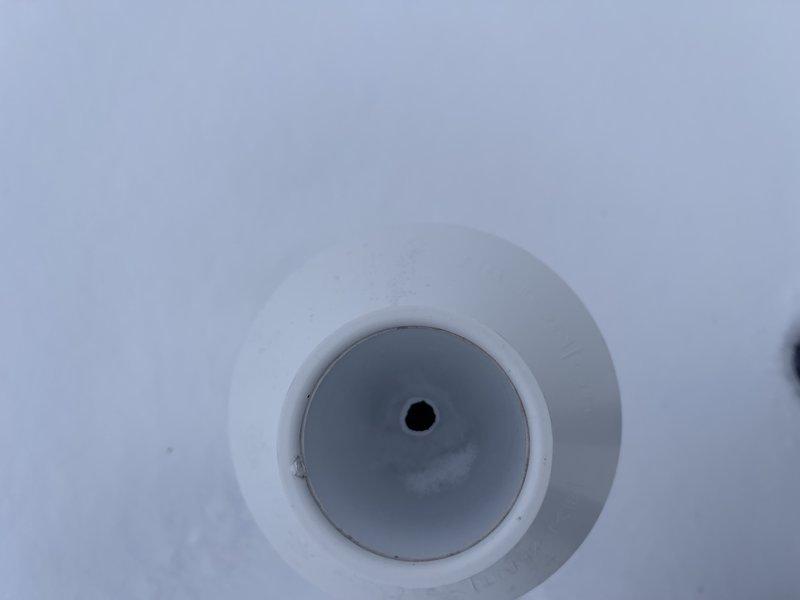 Responded to no heat call and found furnace vent pipe plugged with ice on roof, successfully cleared blockage with chisel to restore heat. Identified need to return to reslope pipe in attic and complete standard maintenance service on main house unit. Second unit in garage remains non-operational per customer report.