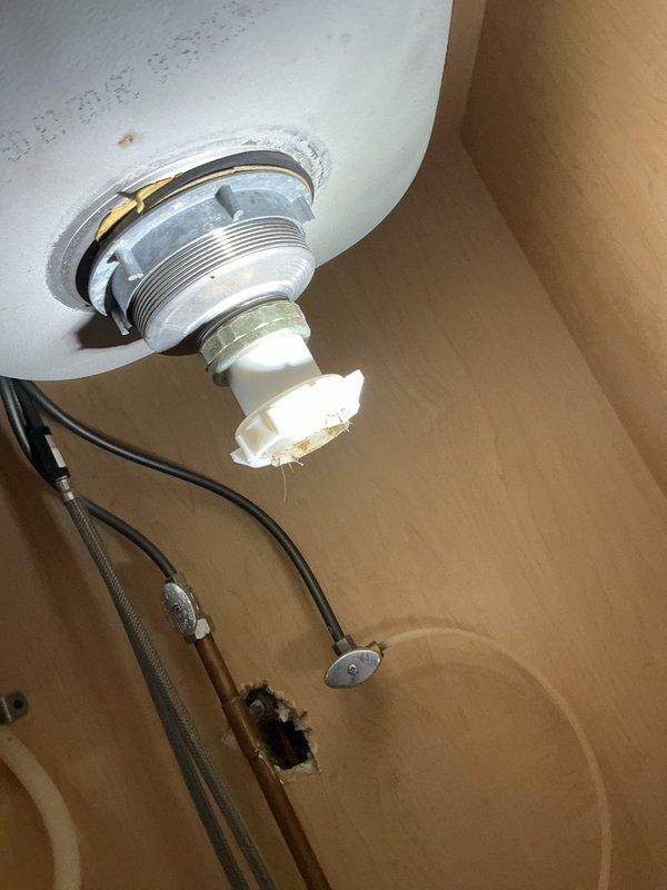 Repaired kitchen sink leak by replacing faulty basket strainers and continuous waste assembly. Removed deteriorated P-trap and installed new components to resolve drainage issues. All connections were tested and confirmed watertight with proper seals at fixture penetrations.