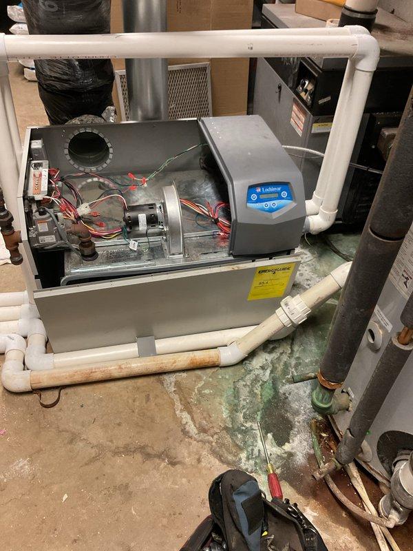 Diagnosed significant water leakage from spa heater, identifying a compromised heat exchanger as the primary issue. Observed evidence of freeze damage likely caused during recent cold temperatures, exacerbated by absence of fresh air motorized dampers that would have prevented cold air infiltration. Submitted parts requisition for either replacement heat exchanger or complete unit, noting that heat exchanger replacement would require full disassembly of the system.