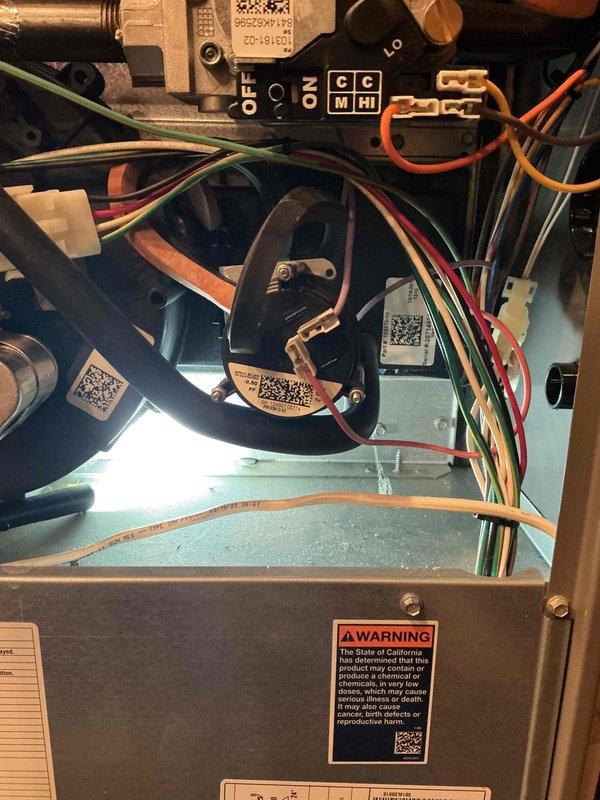 Diagnosed 12-year-old Lennox furnace with intermittent operation and high-pitched noise. Identified pressure switch not closing properly (verified high fire switch requiring 1.5 inwc despite 0.9 inwc rating) and leaking inducer seal with compromised cap on left side of inducer. Furnace temporarily restored to operation after pressure switch adjustment, but customer advised system requires additional service as failure may recur.