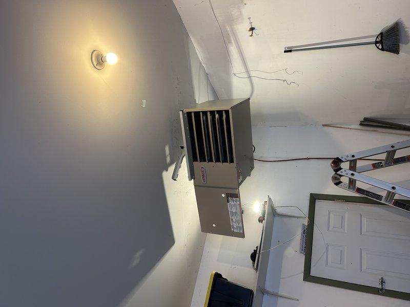 Successfully installed an LF25 Gas Unit Heater as a like-for-like replacement, reusing existing gas lines, electrical connections, and venting system while installing a new vent cap. Unit was mounted and tested properly, but installation remains incomplete due to missing thermostat plug-in component, which will require a follow-up service appointment.