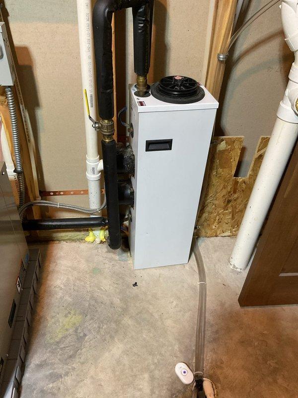 Responded to service call for a leaking geothermal system that was recently installed. Identified a dripping valve on the pump station and resolved the issue by tightening the packing nut, successfully stopping the leak. Documented the repair with photographs of the system installation for service records.