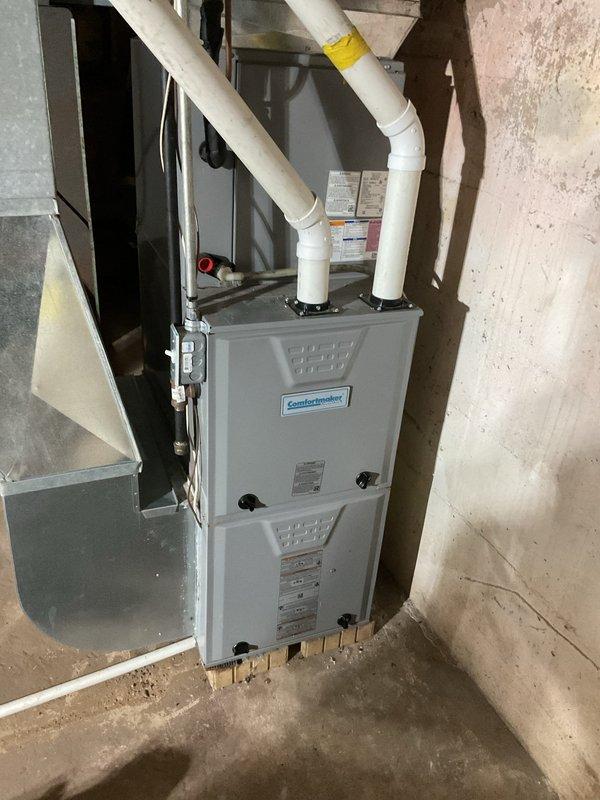 Diagnosed insufficient heat issue on 5-year-old Comfortmaker LP furnace. Found burners operating weakly due to incorrect manifold pressure settings (set for natural gas instead of proper LP specifications). Adjusted high and low manifold pressures to correct LP values, which improved temperature rise to appropriate 57-60° range. Heat exchanger inspection confirmed good condition with no visible issues.