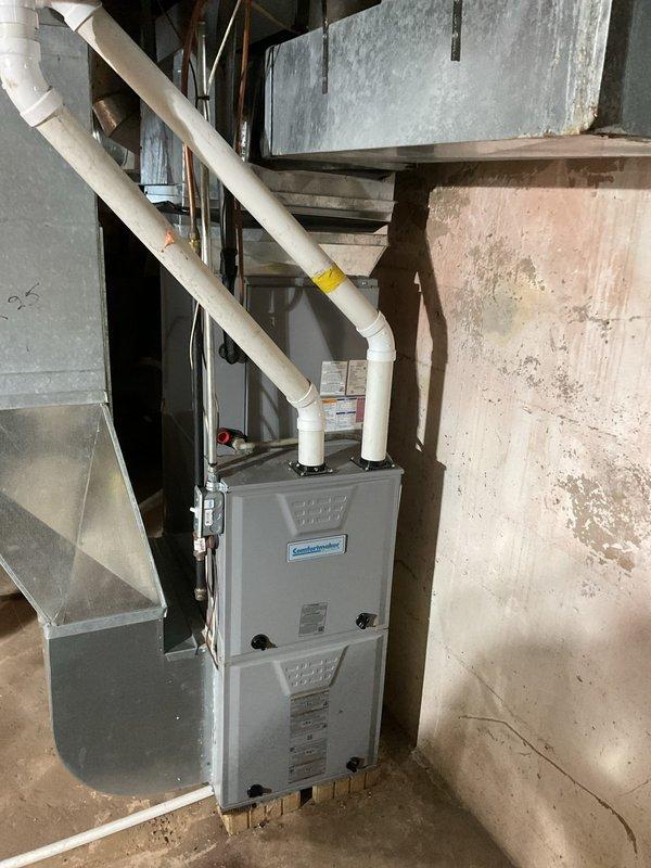 Diagnosed insufficient heat issue on 5-year-old Comfortmaker LP furnace. Found burners operating weakly due to incorrect manifold pressure settings (set for natural gas instead of proper LP specifications). Adjusted high and low manifold pressures to correct LP values, which improved temperature rise to appropriate 57-60° range. Heat exchanger inspection confirmed good condition with no visible issues.