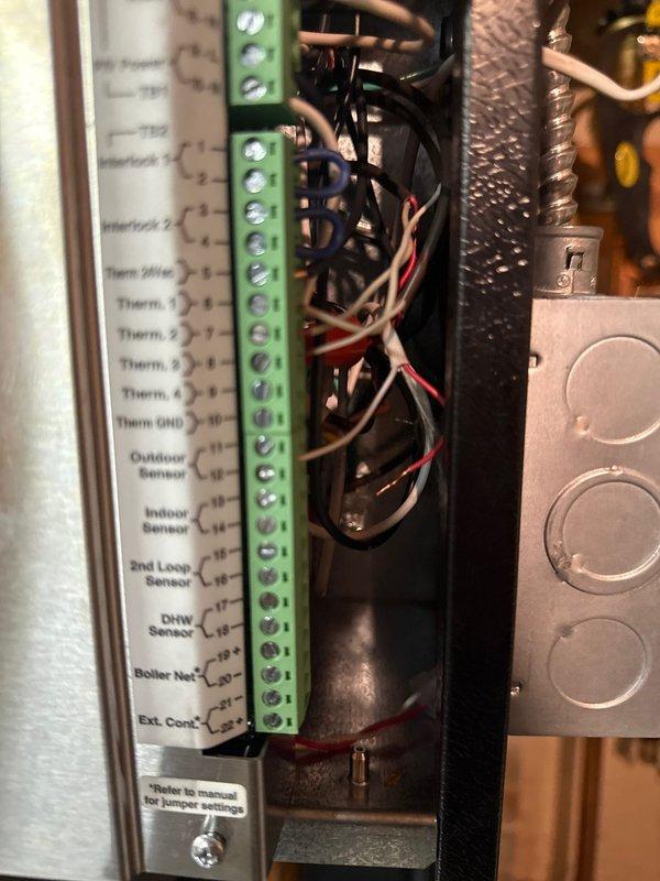 Responded to warranty service call for recently installed boiler system found in standby mode. Discovered faulty outdoor temperature sensor reading 90 degrees, causing system failure. Temporarily disconnected sensor which restored system operation. Verified proper water pressure and cycled all pumps successfully. Determined temperature sensor requires replacement and proper connection to resolve the heating issue affecting all floors of residence.