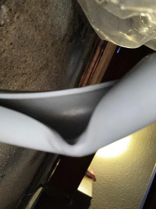 Responded to customer inquiry regarding water leak under kitchen sink in older mobile home. Upon inspection, discovered water line blowout beneath the structure. Removed damaged pipe section and documented condition of underfloor plumbing components. No repairs were performed as customer requested estimate only.