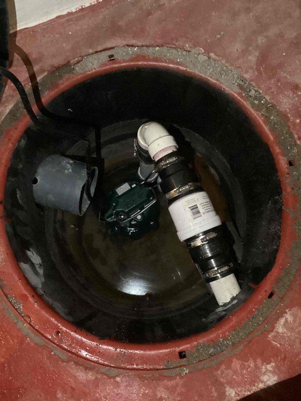 Replaced failing sump pump in basement utility room with new 1 1/2" automatic model. Installed check valve and upgraded connections/piping up to 3 feet to properly remove water and condensation from the installation area.