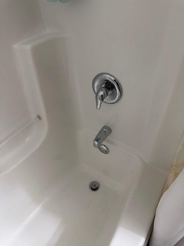 Responded to service call for shower/tub with complete water shutoff issue. Diagnosed faulty tub/shower cartridge as the cause of continuous water flow. Successfully removed old cartridge showing significant mineral buildup and corrosion, and installed new replacement cartridge to restore proper functionality.