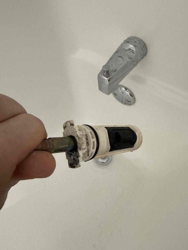 Responded to service call for shower/tub with complete water shutoff issue. Diagnosed faulty tub/shower cartridge as the cause of continuous water flow. Successfully removed old cartridge showing significant mineral buildup and corrosion, and installed new replacement cartridge to restore proper functionality.