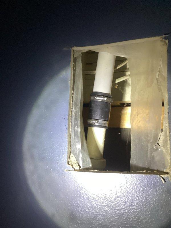 Responded to water leak service call where customer reported water leaking through basement ceiling when using kitchen sink and dishwasher. Upon inspection, discovered a hole in the galvanized pipe connecting the kitchen sink to the main stack. After presenting repair options, replaced the entire drain line to the kitchen sink, installed new P-trap, and added a tutor vent to ensure proper drainage and eliminate the leak.