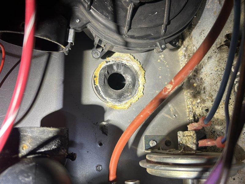 Responded to no heat call on LP furnace. Upon inspection, discovered seized inducer motor and multiple cracks in the heat exchanger faceplate. Visual inspection confirmed significant corrosion and metal deterioration at critical connection points. Recommended replacement of system due to age (28 years) and safety concerns from compromised heat exchanger. Scheduled service advisor follow-up to discuss replacement options.