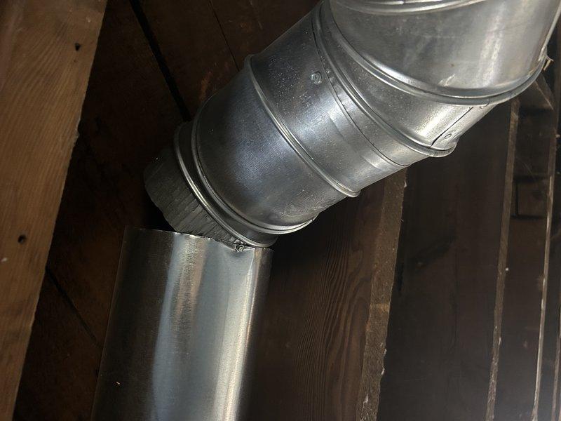 Responded to customer complaint of vibrating noise during furnace operation. Inspection revealed a bathroom vent duct that was completely disconnected. Reattached the ductwork properly, which significantly reduced the reported noise. Customer confirmed improvement in system operation after repair.
