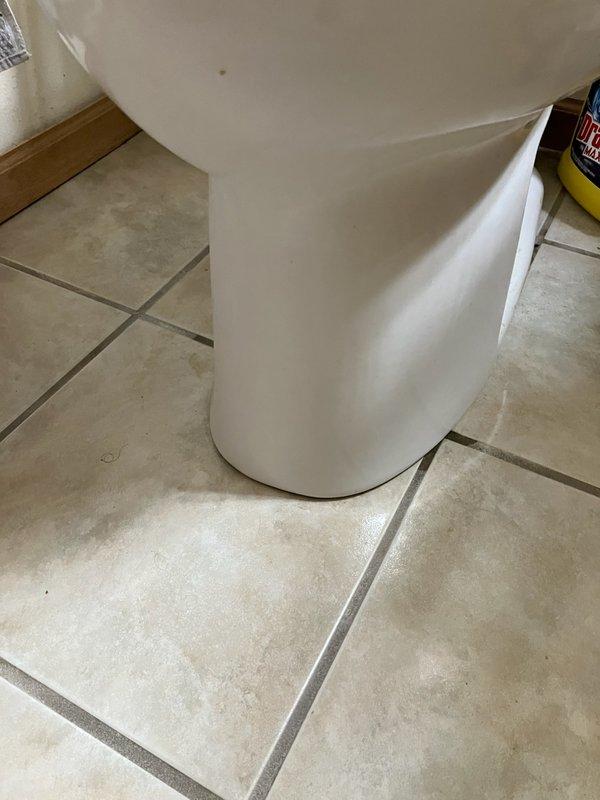 Responded to emergency service call for toilet leaking and flooding bathroom. Diagnosed failed wax seal and broken closet flange causing water to escape from base during flushing. Replaced damaged closet flange and installed new wax ring, successfully resolving the leak.