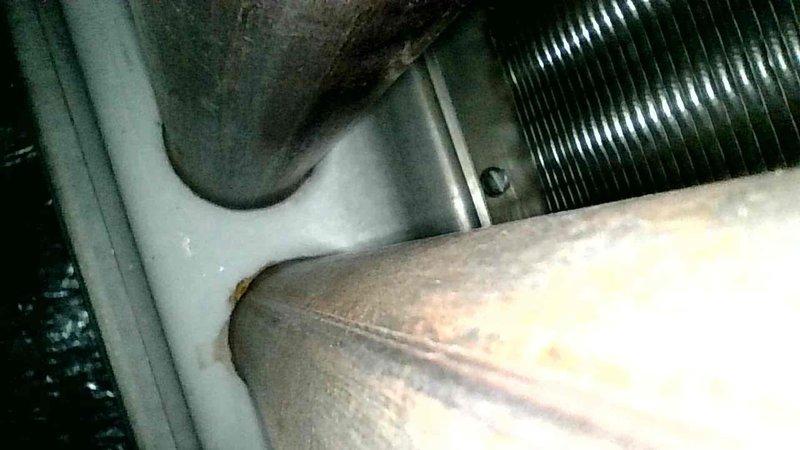 Responded to no heat call where thermostat was not communicating with furnace. Diagnosed blower motor not spinning freely as primary issue. Inspected heat exchanger for cracks or holes with none found to be condemnable. Customer opted for motor replacement; part will be ordered and installed on follow-up visit.