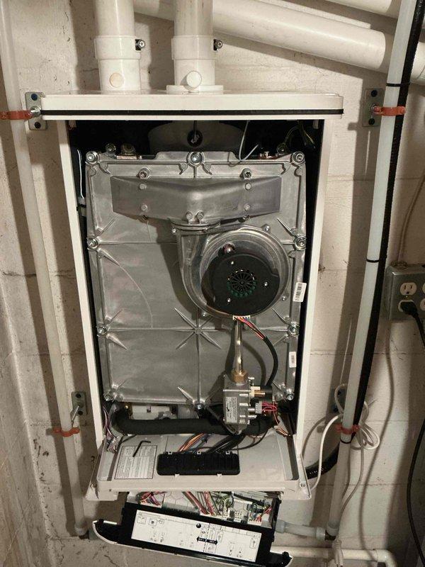 Responded to service call for recently installed tankless water heater (17 days post-installation) that was non-operational with no lights on unit and no hot water production. Diagnosed faulty control board as the root cause while confirming water softener was functioning properly. Ordered replacement control board to restore system functionality.