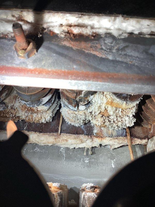 Inspected customer's old boiler after reports of circulation pump issues and water leakage. Diagnostic assessment revealed extensive damage including water leaking from the bottom of the boiler cast onto burners and multiple rust perforations through the bottom side of the boiler. Determined unit requires complete replacement as repairs are not feasible; scheduled service advisor to discuss replacement options.