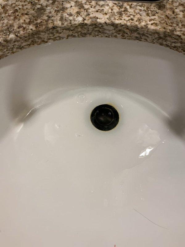 Responded to service call for an upstairs bathroom sink with severe clogging beyond customer's ability to resolve. Utilized drain snake machine to successfully clear the blockage in the drain line. Performed multiple drain tests by filling the sink basin completely to verify proper drainage had been restored and normal water flow was achieved.