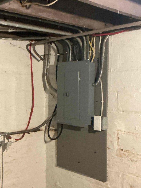 Responded to warranty service call for 6-month-old IBC combi boiler experiencing ignition failure errors. Inspected and found igniter/flame rod covered with combustion slag. Cleaned component and reinstalled, confirming proper operation with flame rod reading 22 micro amps during hot water demand. Advised that igniter replacement under warranty may be necessary if issue persists.