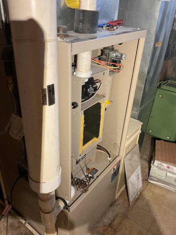 Responded to no-heat call for 1993 furnace. Diagnostic testing revealed ignition failure despite normal fan operation. Pulse pressure test identified approximately 1 PSI drop over 12-15 minutes. Inspection found green corrosion buildup on secondary manifold, indicating potential heat exchanger deterioration in this 30-year-old system.