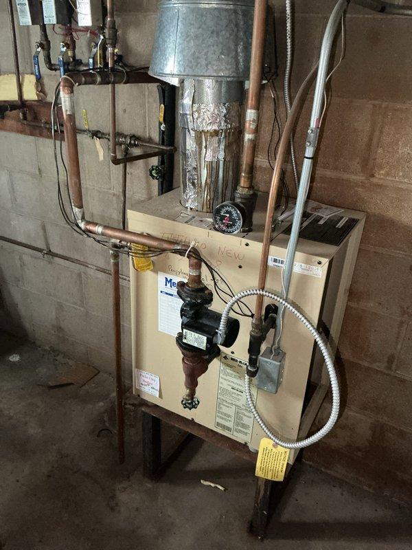 Responded to no-heat call at triplex property. Diagnosed boiler system with zero pressure and failing circulator pump not pushing water through the system. Observed severe deterioration and corrosion at heat exchanger base, likely causing pressure loss through pinhole leaks. Scheduled same-day estimate for complete boiler replacement as repair options would be temporary due to heat exchanger condition.