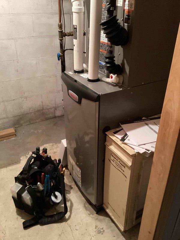 Completed warranty service on tankless water heater by replacing defective control board. Installed new control board, performed system startup, and verified proper operation by testing hot water flow at multiple faucets. Unit now heating correctly and cycling as designed.