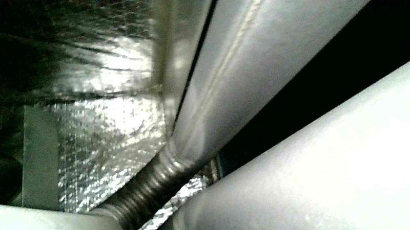 Responded to no heat complaint in residence with system likely 10+ years old based on observed component deterioration. Diagnosed locked inducer motor as primary failure cause. Inspection revealed significant corrosion on metal components and fasteners, particularly at connection points. Also identified poor airflow issue in bedroom duct requiring attention. Provided customer with replacement options for inducer motor, burner assembly, and collector box cleaning.