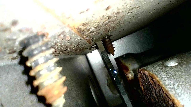 Responded to no heat complaint in residence with system likely 10+ years old based on observed component deterioration. Diagnosed locked inducer motor as primary failure cause. Inspection revealed significant corrosion on metal components and fasteners, particularly at connection points. Also identified poor airflow issue in bedroom duct requiring attention. Provided customer with replacement options for inducer motor, burner assembly, and collector box cleaning.