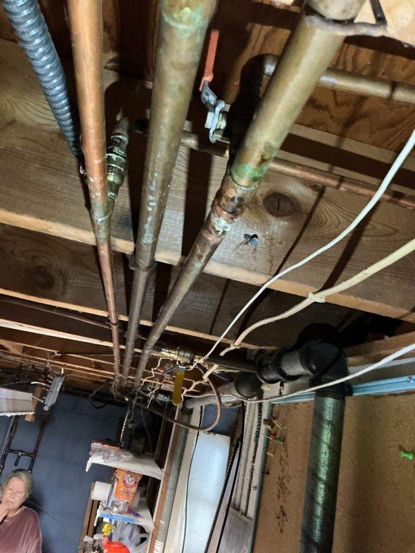 Diagnosed and repaired a leaking hose bib that had developed a failed solder joint. Shut off main water supply, removed compromised section, and installed new copper fittings to restore proper function. Visual inspection of surrounding copper piping revealed oxidation but no additional active leaks.