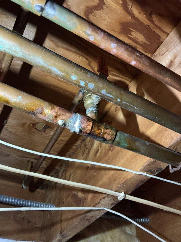 Diagnosed and repaired a leaking hose bib that had developed a failed solder joint. Shut off main water supply, removed compromised section, and installed new copper fittings to restore proper function. Visual inspection of surrounding copper piping revealed oxidation but no additional active leaks.