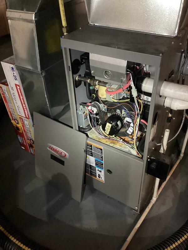 Diagnosed excessive noise in 13-year-old Lennox natural gas furnace. Inspection of internal components revealed the inducer motor showing significant wear, causing the loud operational noise. Advised homeowner that inducer motor replacement is recommended, but customer opted to source and install replacement parts independently.