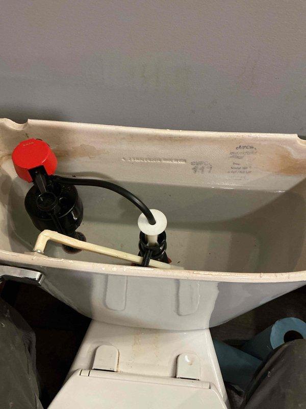 Responded to service call for a Mansfield toilet with water spraying issue. Upon inspection, diagnosed a defective fill valve causing the spray problem. Replaced both the fill valve and flush valve gasket to restore proper functionality and eliminate leakage.