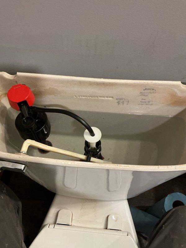 Responded to service call for a Mansfield toilet with water spraying issue. Upon inspection, diagnosed a defective fill valve causing the spray problem. Replaced both the fill valve and flush valve gasket to restore proper functionality and eliminate leakage.