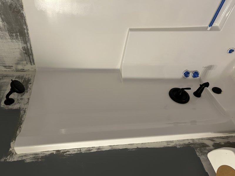Performed shower trim kit installation in customer's bathroom. City personnel required for water shut-off as main house valve is malfunctioning. Successfully installed new black bathroom fixtures including faucet handle and shower head. Customer will schedule follow-up service to address the failing main water shut-off valve.