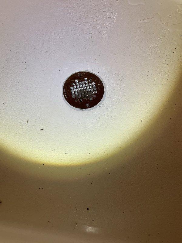 Completed replacement of 2-inch shower drain strainer and trap assembly that was leaking. Removed old components, installed new shower strainer and trap per estimate. All connections were properly sealed and system was tested for proper drainage with no leaks observed.