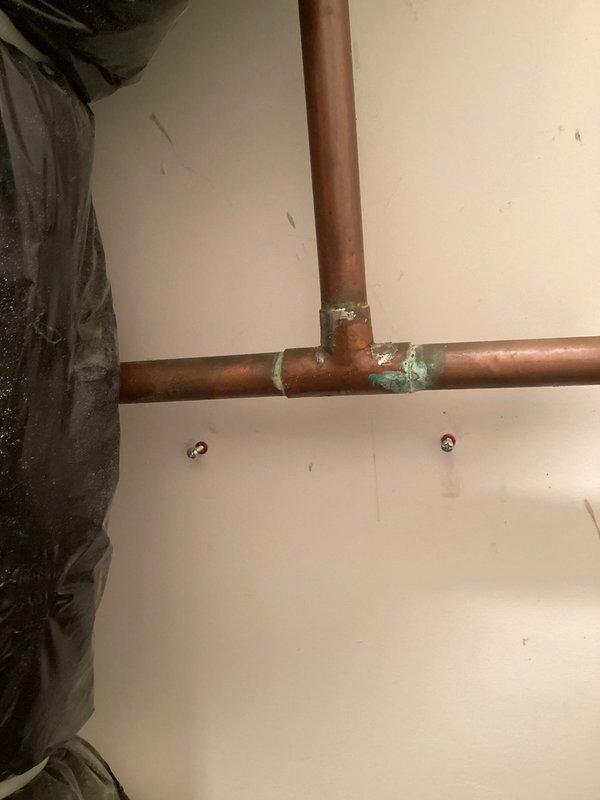Performed a comprehensive plumbing inspection, identifying significant corrosion on kitchen hot water supply lines. Replaced deteriorated shut-off valves for both dishwasher and kitchen sink to prevent potential leaks and ensure proper functionality. Documented corrosion at copper pipe junctions requiring future attention.