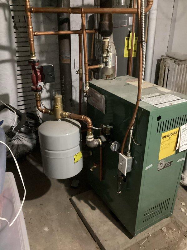 Performed scheduled maintenance on residential boiler system. Found boiler temperature set too low (adjusted to 175°) and identified a seized radiator valve in upper level bedroom. Successfully bled air from upper level radiator and verified proper operation of the heating system.