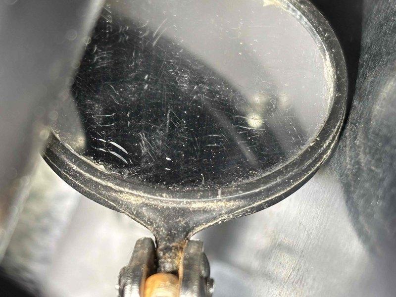 Responded to service call regarding water accumulation around furnace installed in October. Inspection revealed humidifier completely filled with mineral deposits causing water overflow. Also identified improper installation where AC drain line clamp screw had penetrated through flue pipe creating potential safety hazard. Replaced humidifier pad and recommended proper rerouting of humidifier water line to hot water supply with removal of piercing valve.