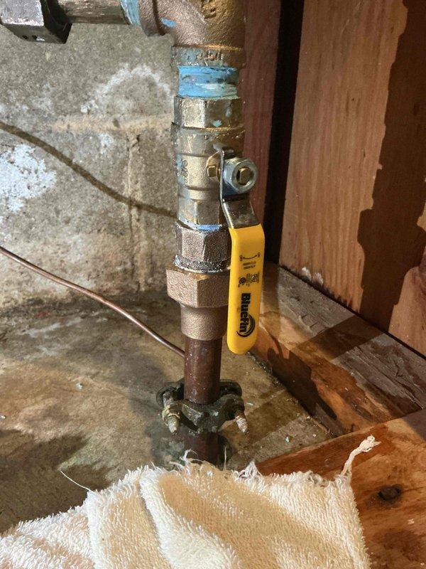 Completed residential plumbing inspection to address water leakage issue. Identified faulty flare on copper line coming through floor. After city water shutoff, replaced adapter and flare nut to resolve the leak.