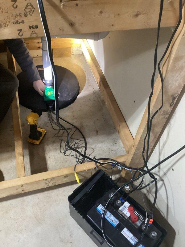 Responded to service call for sump pump alarm activation. Diagnosed system and found main sump pump functioning properly with operational float. Identified loose wire connections as the cause of persistent alarm. Tightened all electrical connections on the battery backup system, which resolved the alarm issue. Verified complete system operation before departure.