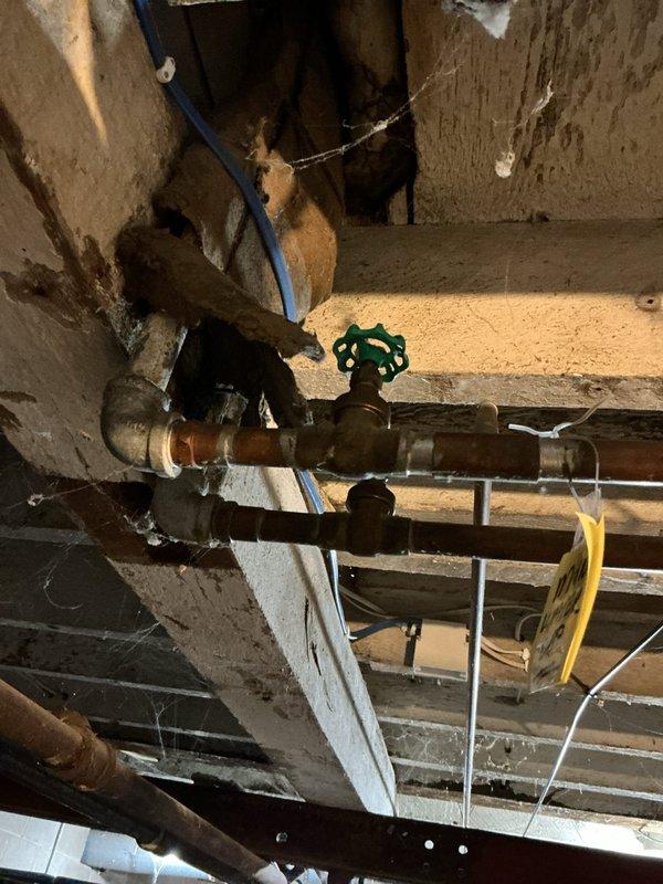 Located and labeled upstairs water shut-off valves for customer as requested. Inspected existing plumbing system during service call, noting copper pipe assembly with functioning valves in utility area. Customer expressed interest in complete building re-pipe; scheduled follow-up appointment for comprehensive estimate.