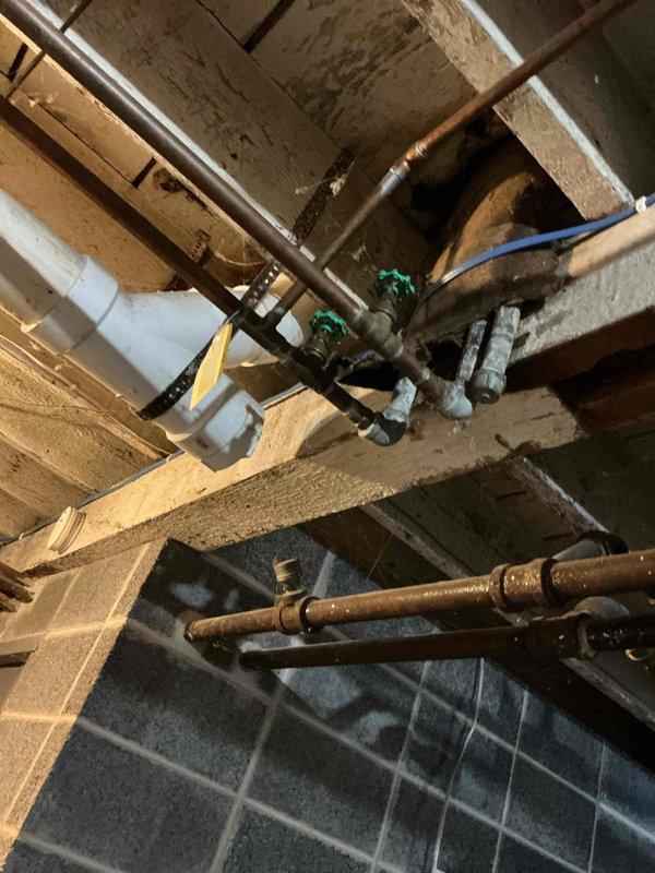 Located and labeled upstairs water shut-off valves for customer as requested. Inspected existing plumbing system during service call, noting copper pipe assembly with functioning valves in utility area. Customer expressed interest in complete building re-pipe; scheduled follow-up appointment for comprehensive estimate.