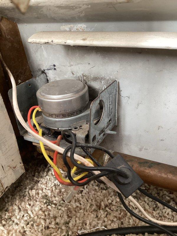 Diagnosed overheating issue in unit caused by a failed zone valve motor that had been previously forced open by maintenance personnel. Temporarily closed the valve to reduce heat in unit while documenting the required replacement part. Customer advised that valve may need to be reopened if neighbors report heat loss prior to permanent repair.