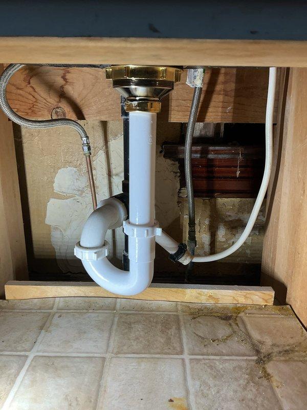 Installed new white round comfort-height toilet as requested by customer. Completed installation of customer-supplied bathroom faucet, clawfoot tub faucet, and basket strainers for kitchen and bathroom sinks. All components were properly connected and tested for proper function.