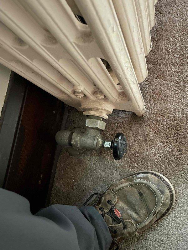 Responded to service call for recurring boiler issues. Diagnosed high system pressure (18 psi at 180°F), verified with external gauge, and identified a faulty pressure relief valve that was dripping into overflow container. Replaced defective relief valve under warranty, adjusted system pressure to proper 12 psi setting, and bled all radiators on main and upper floors to remove air from system. Confirmed proper operation of boiler system after repairs.