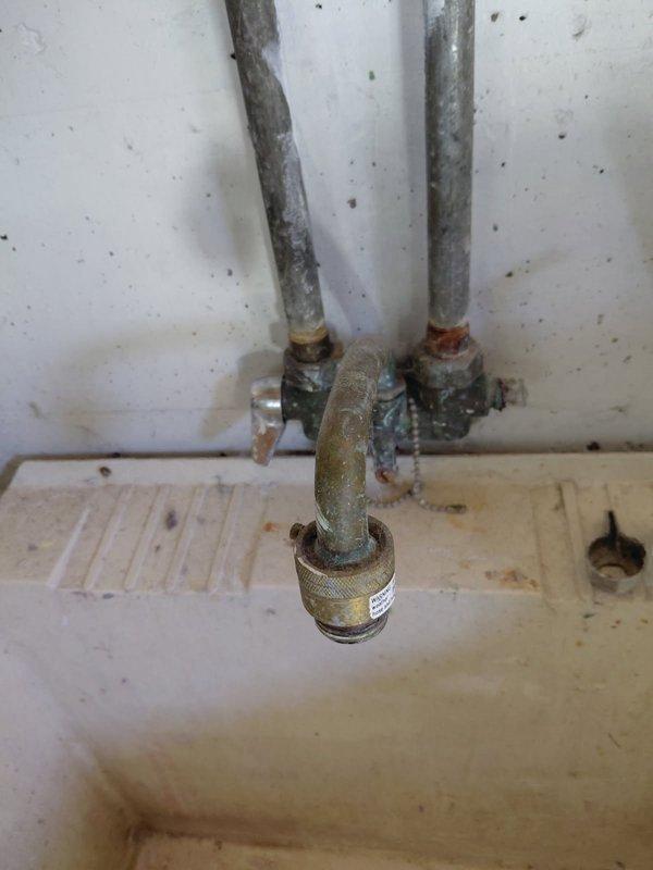 Completed annual plumbing inspection for Ella at her request. Examined laundry sink faucet which showed significant corrosion and aging on supply lines and valves. Installed new laundry tub faucet and replacement washer/dryer valves to address deterioration of existing fixtures.