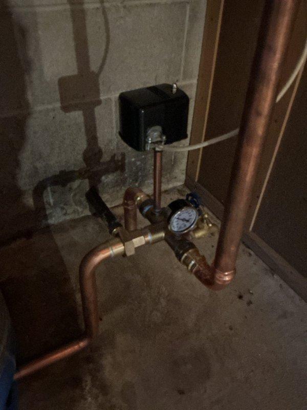 Replaced failed well pressure tank that was causing water leakage on basement floor. Installed new pressure tank per approved estimate, ensuring proper connection to existing copper piping and pressure gauge assembly. System now operating at correct pressure with no leaks.