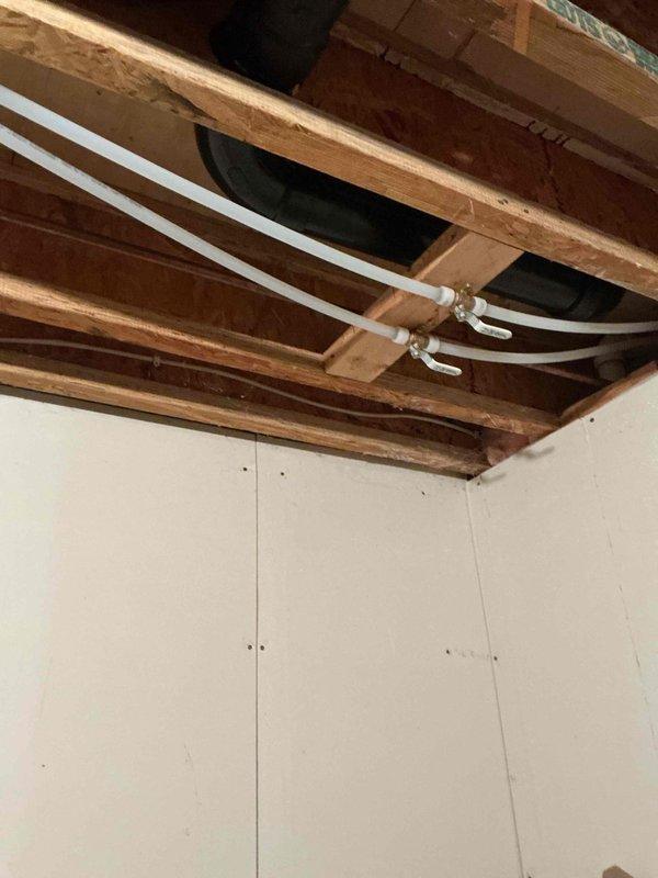 Responded to complaint of loud humming noise occurring when toilets are flushed in a well-supplied residence. Identified vibration in the cold, soft water line within the mechanical room as the source of noise transmission throughout the house. Removed support clamps securing copper lines to wooden framing members, which eliminated the vibration issue. Instructed customer to contact if noise recurs.