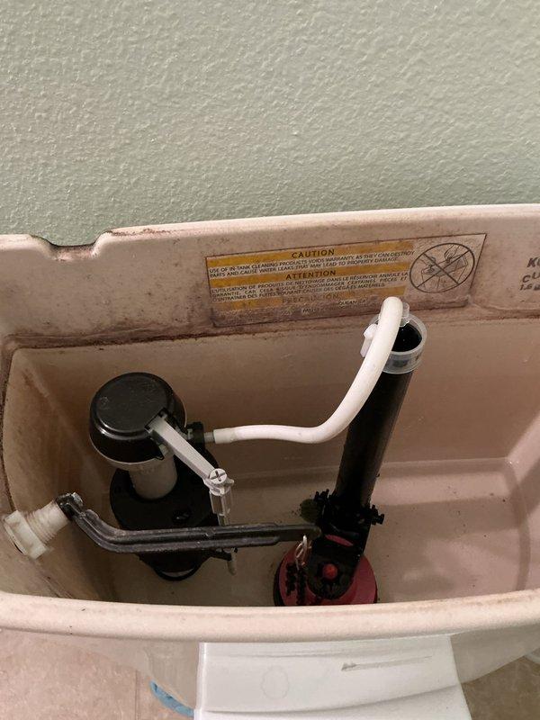 Responded to water leak issue at toilet. Upon inspection, found leakage at the supply line which had repeatedly loosened after recent replacement of fill and flush valve by carpenter. Replaced hard supply line with flexible supply line to address the recurring issue. Tested water pressure and found elevated reading of 85 psi. Advised homeowner about pressure reducer options to prevent future plumbing problems.